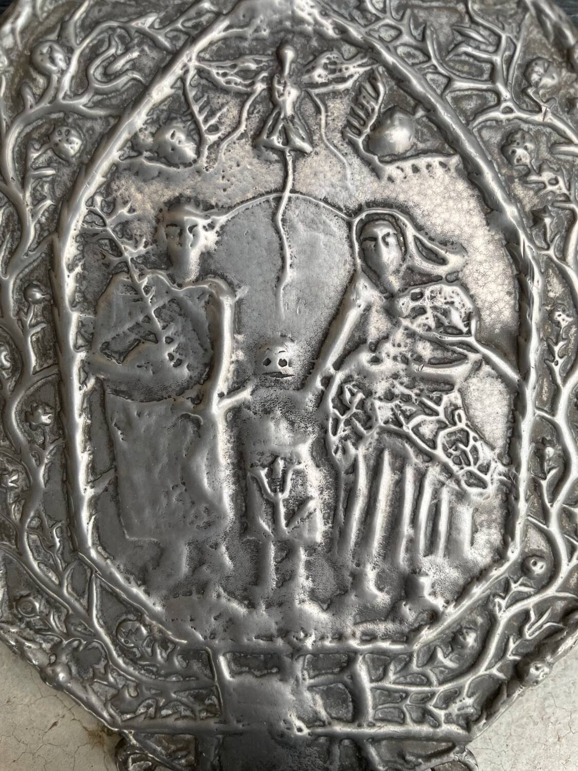 Small wall-mounted holy water font