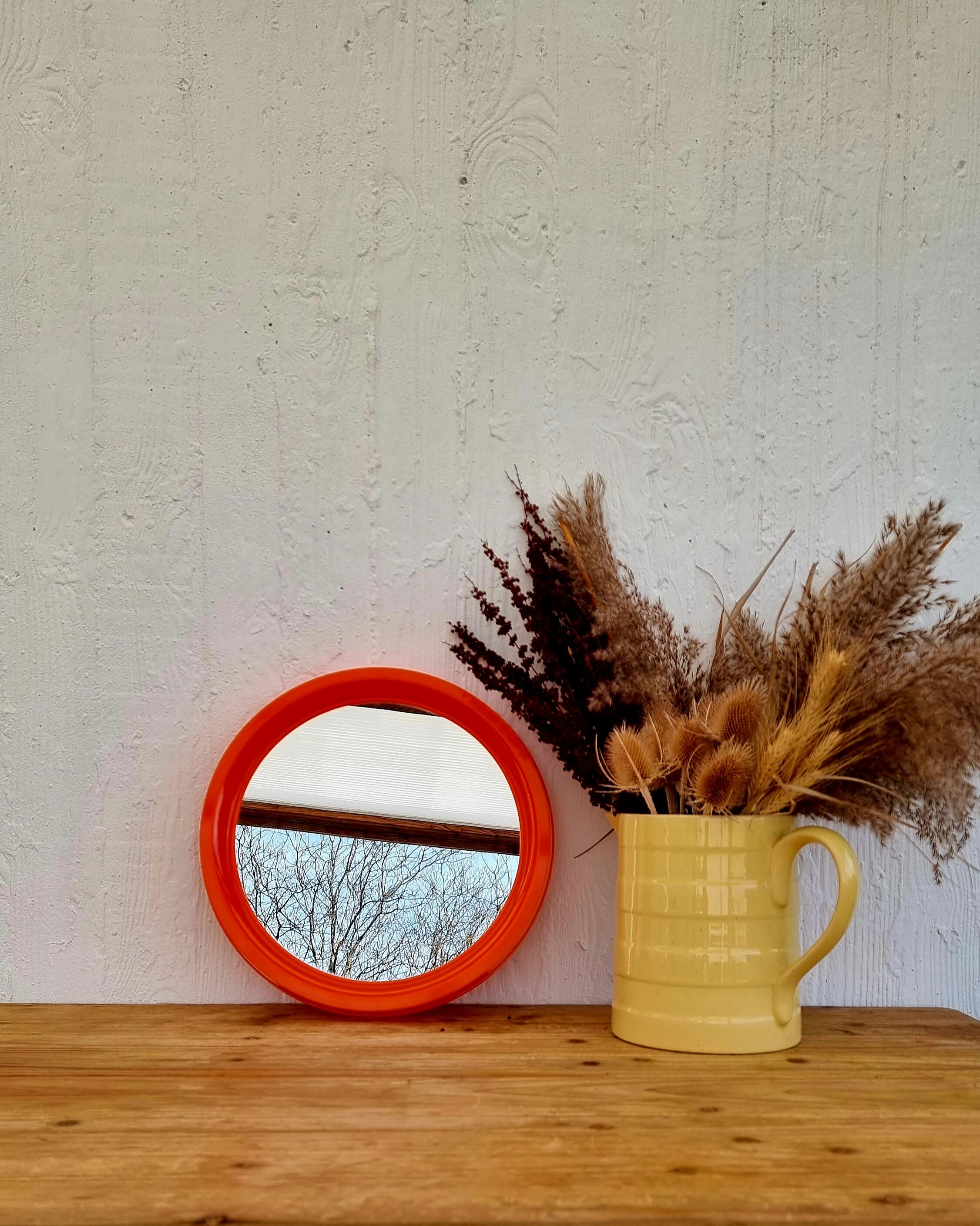 Vintage orange round mirror
