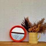 Vintage orange round mirror