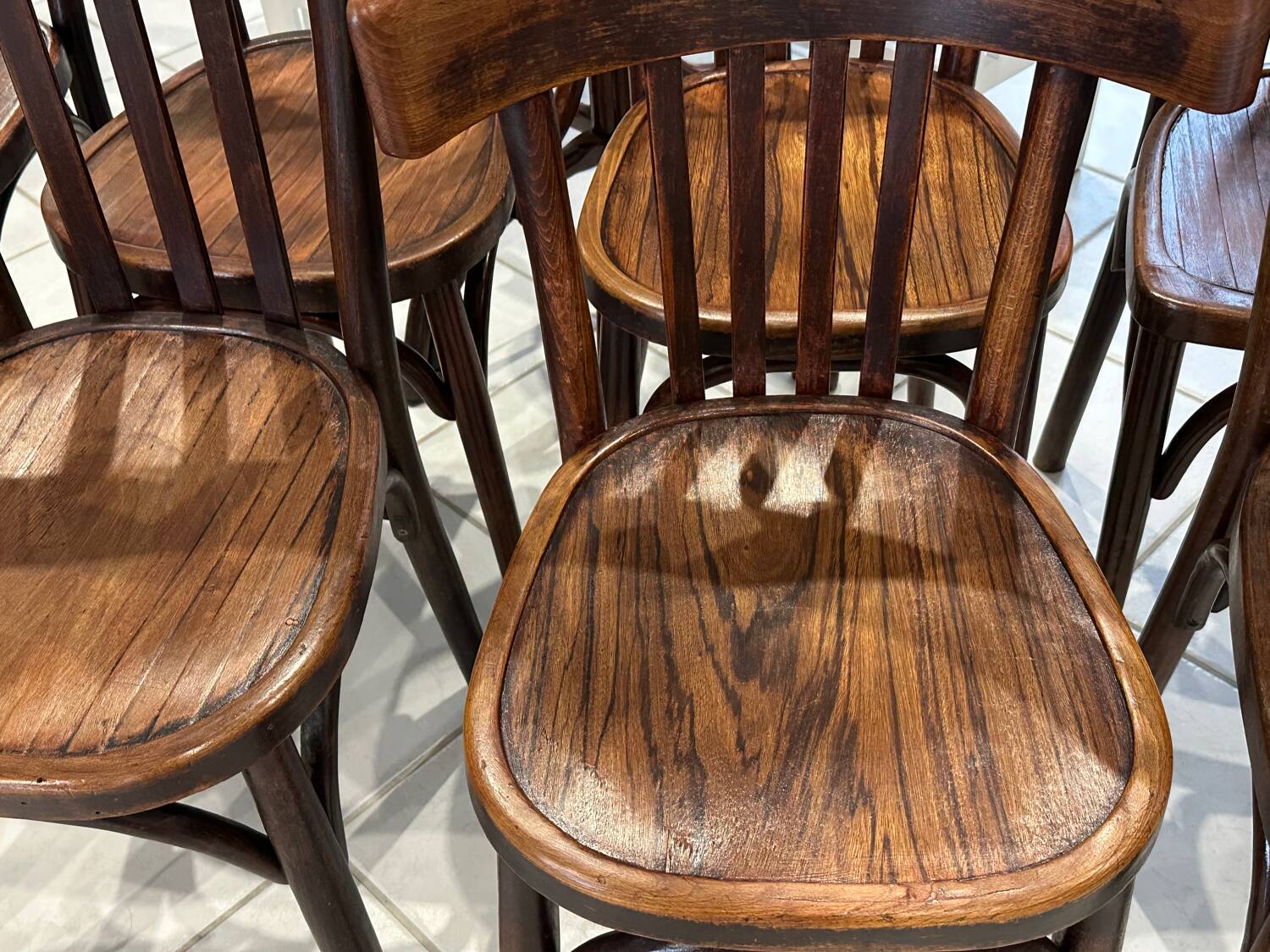 Set of 12 mismatched bistro chairs Baumann & Fischel 1930