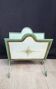 Vintage magazine rack in painted sheet metal