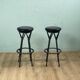 2 tabourets pivotant design Yamakado en cuir noir