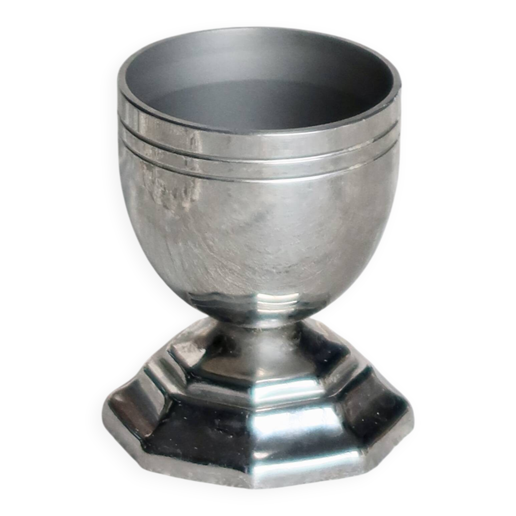 Vintage silver-plated egg cup with an octagonal base.