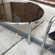 Mid-Century tubular coffee table with grey smoked glass and chrome metal, 1960s design.