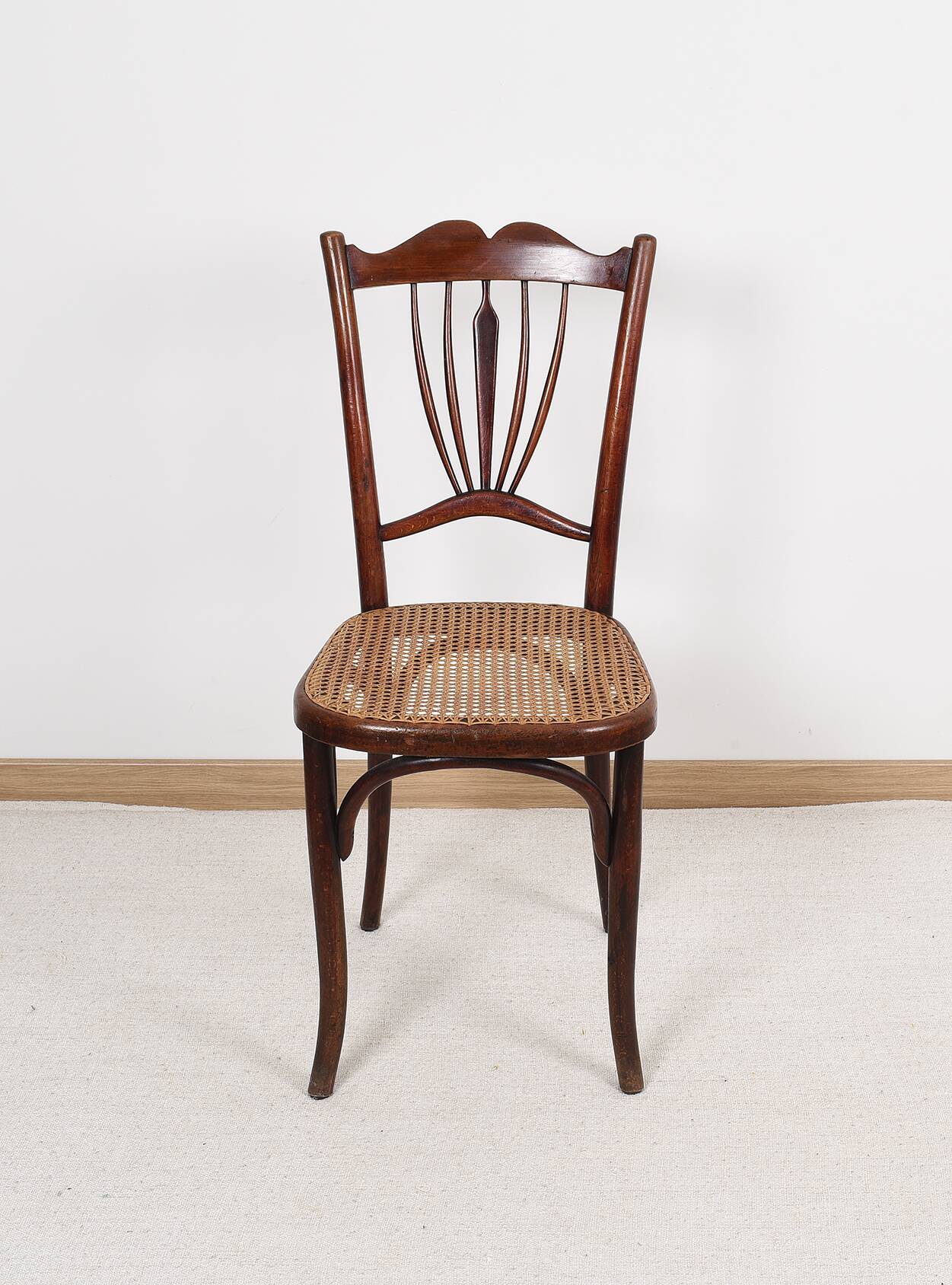 Old cane bistro chair, stamped fischel