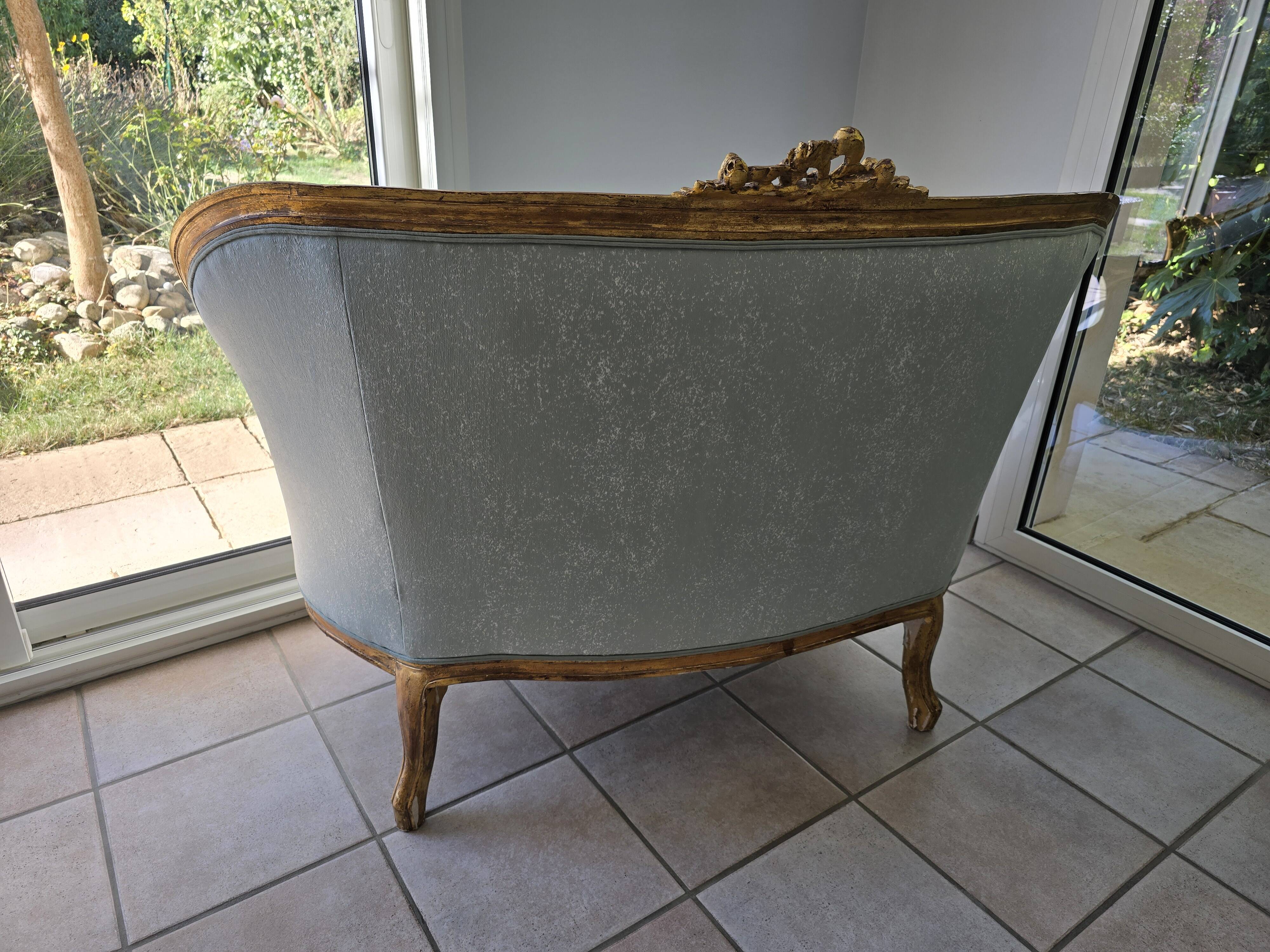 Louis XV gilt basket canapé with green velvet.