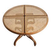 Round dining table in curved wood with a rattan top by Mundus, 1960s.