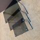Set of 3 nesting tables in metal and smoked glass.
