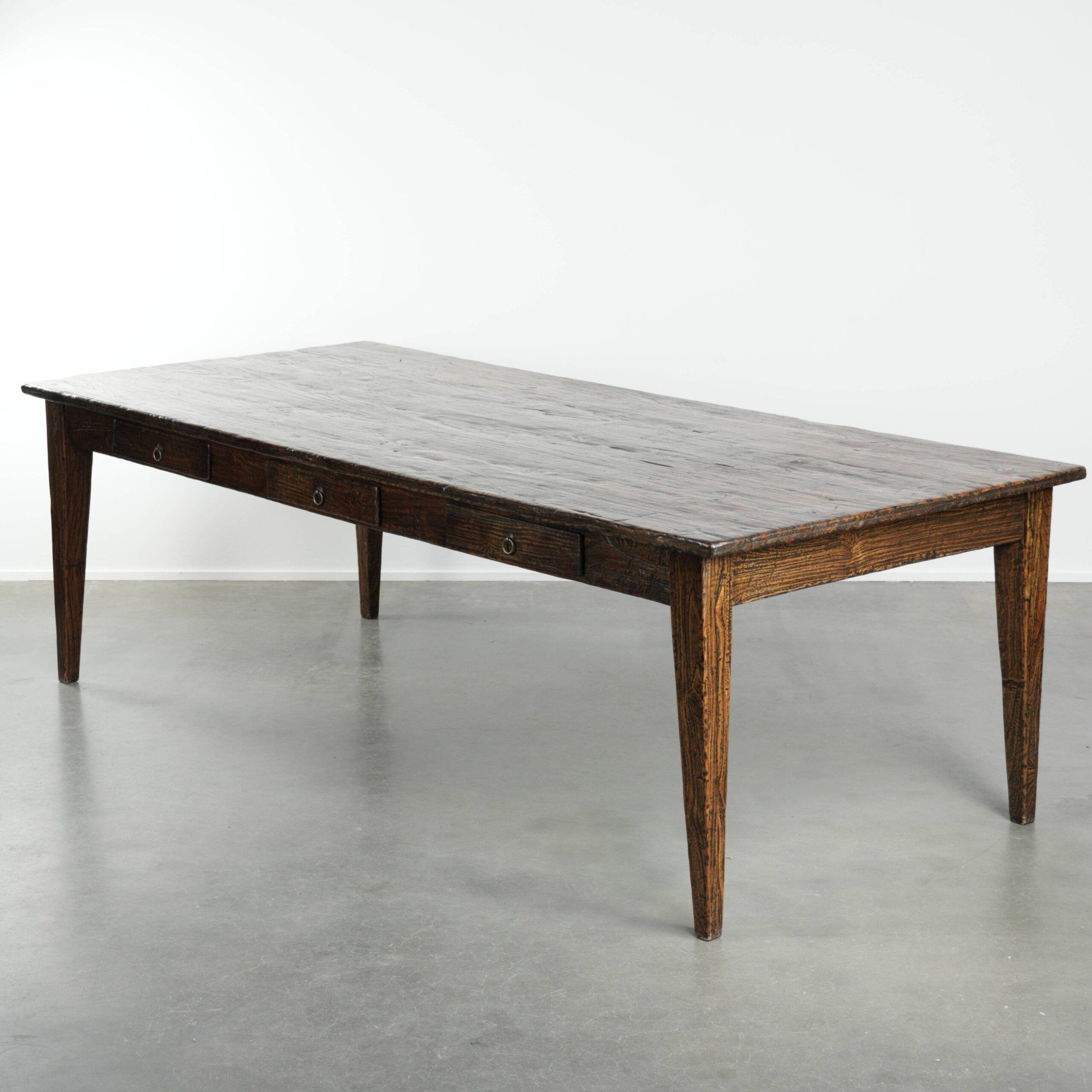 Large rustic dining table made of atmospheric elm wood with fine details