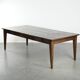 Large rustic dining table made of atmospheric elm wood with fine details