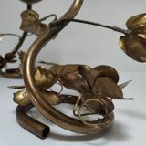 Pair of brass candle holders decorated with patinated metal flowers