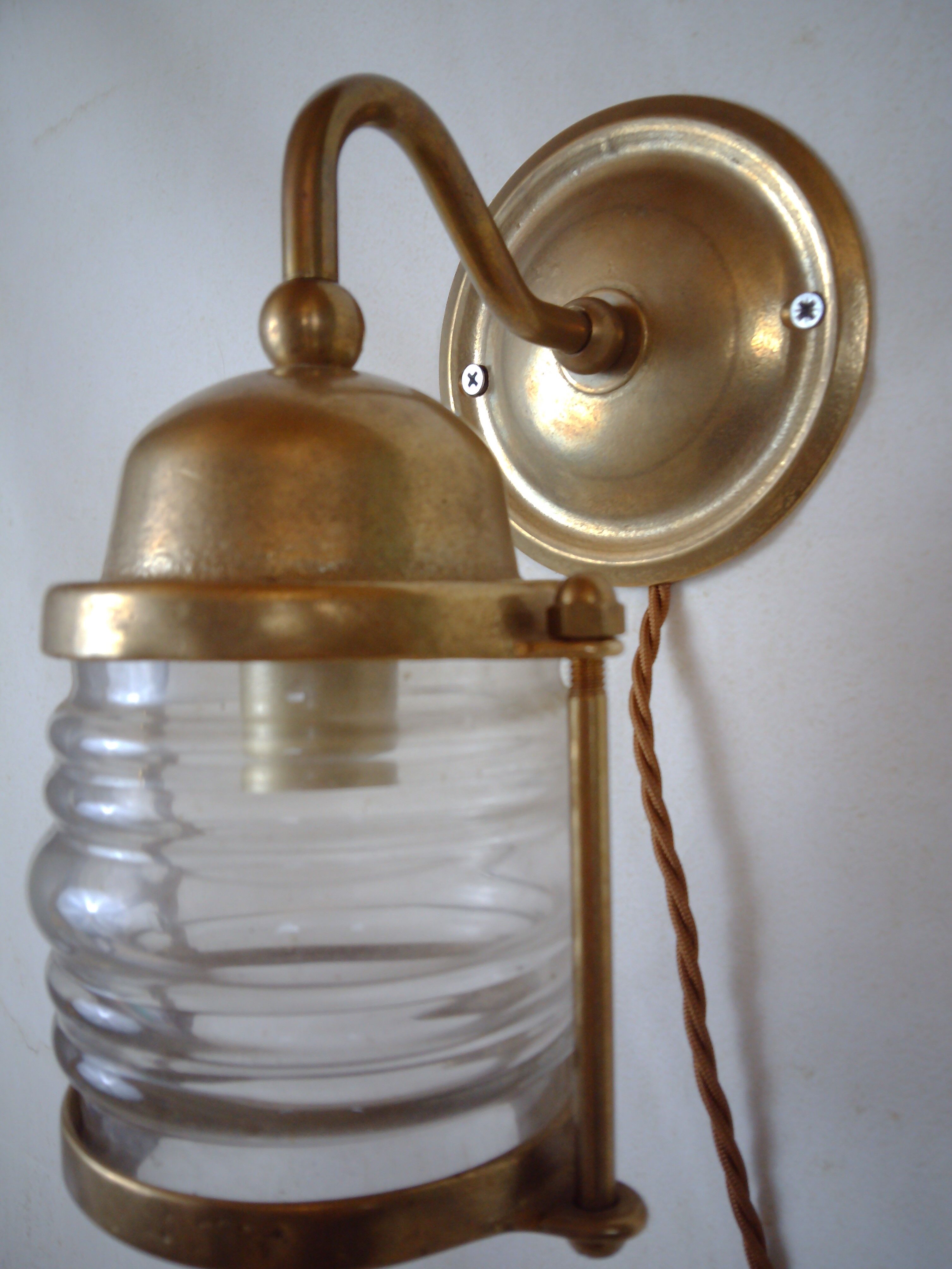 Vintage wallmounted brass lamp from a ship.