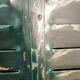 Lot of old green shutters in 4-part iron screen headboard