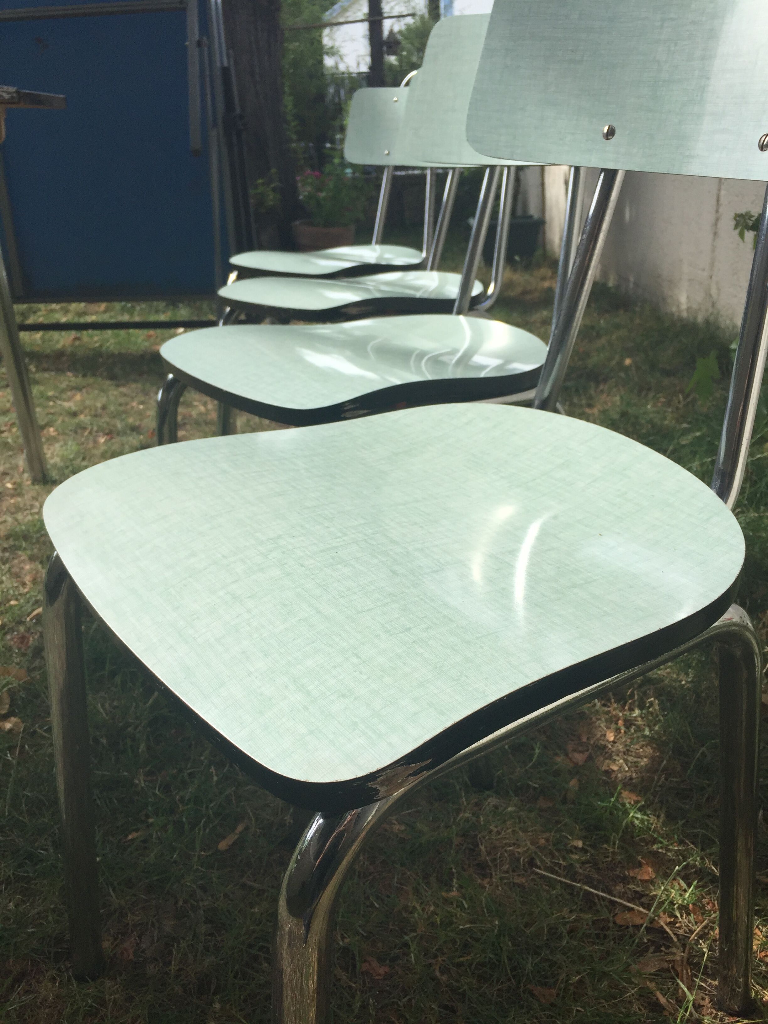 Table and 4 green water formica chairs 60's
