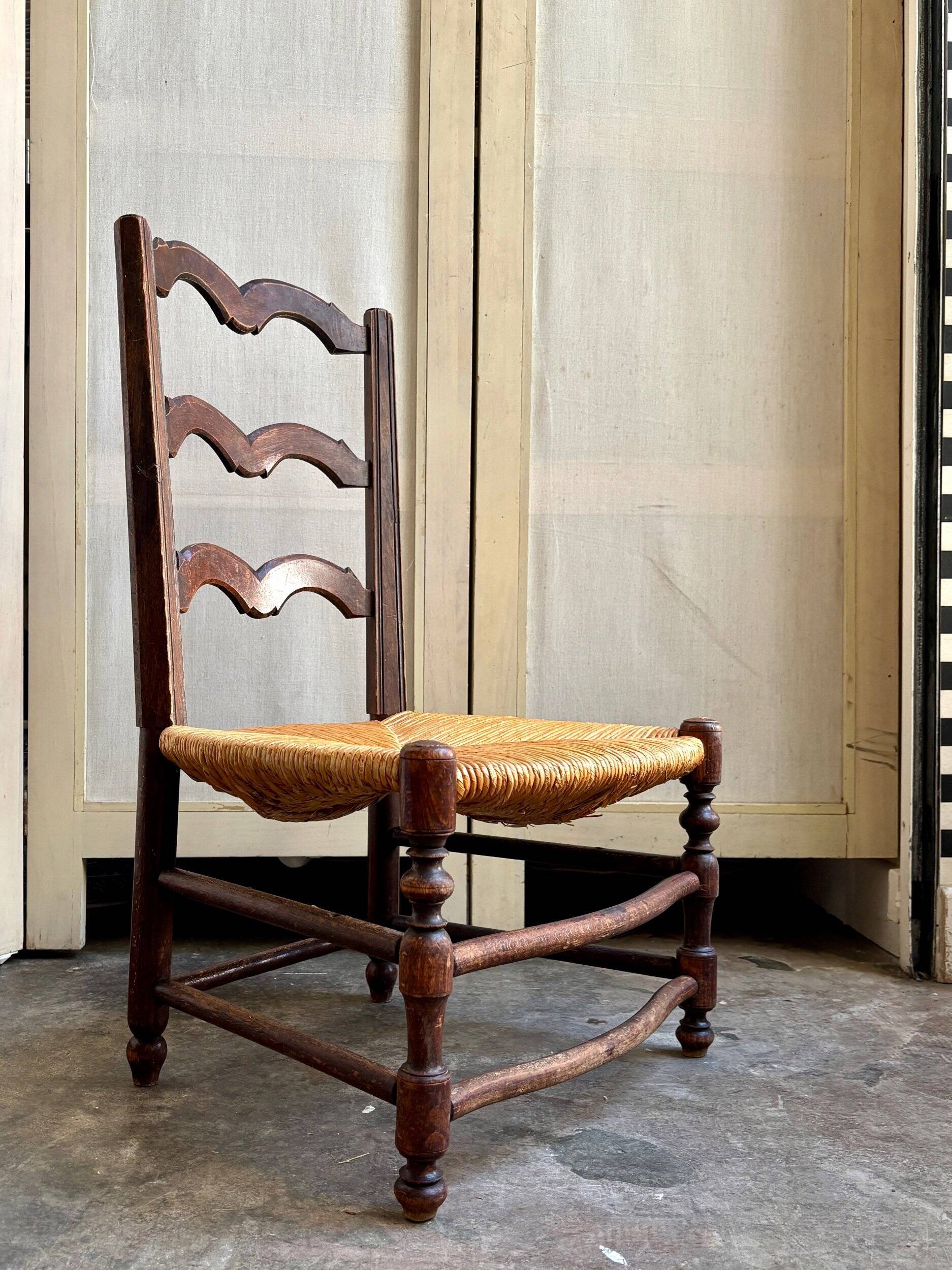 Low Provencal chair in dark wood and woven straw