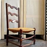 Low Provencal chair in dark wood and woven straw