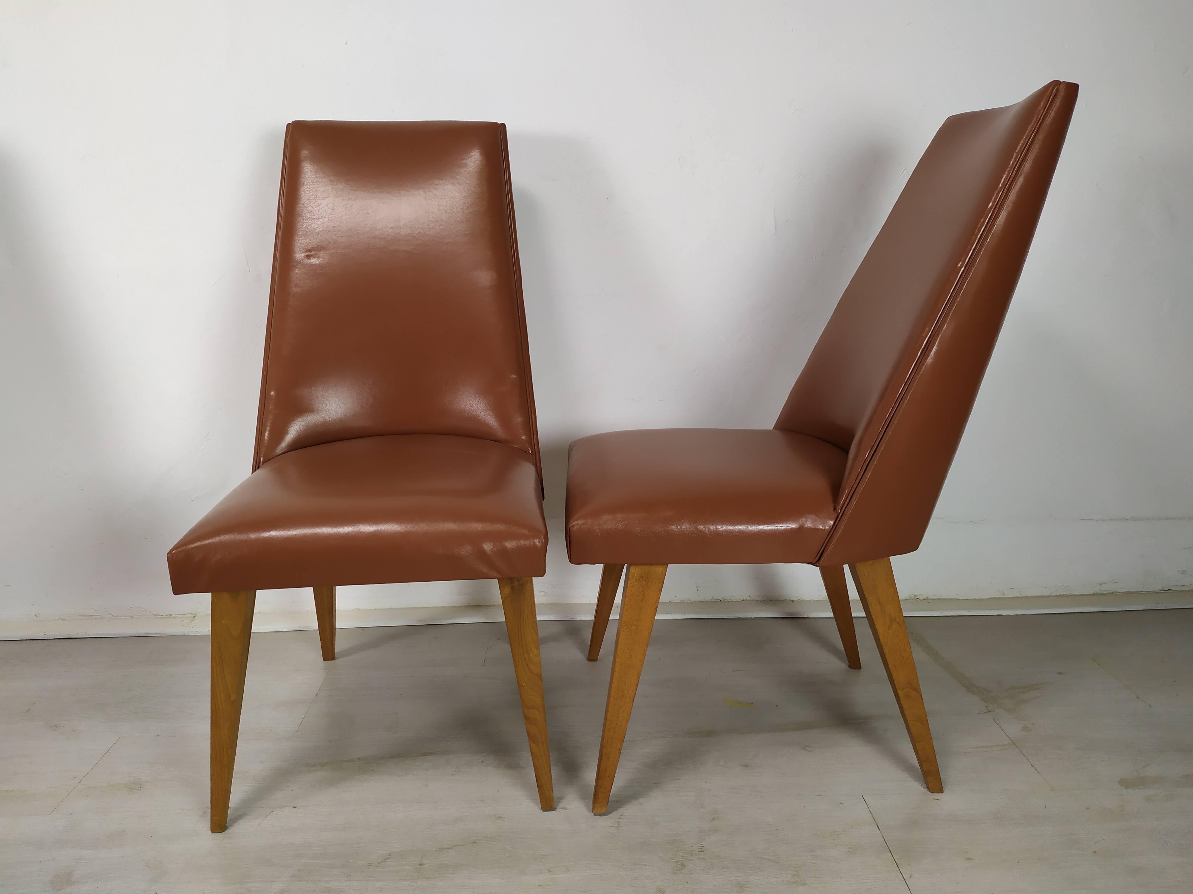 8 brown skai chairs 1950