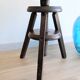 Antique wooden watchmaker's stool with screws, patinated wood.