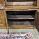 Library in walnut and oak from the early 20th century with its central clock.