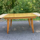 Extendable vintage table with tapered legs.