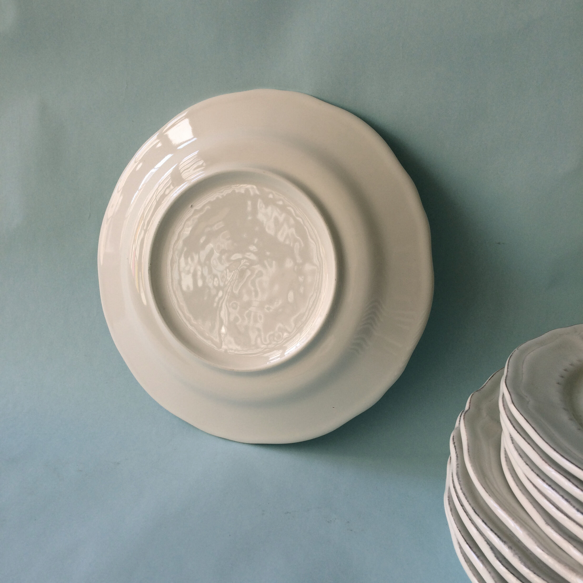 White plates in glazed red earth