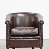 dark cowhide club chair in English style
