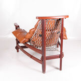 Vintage-style leather and rope armchair and its ottoman