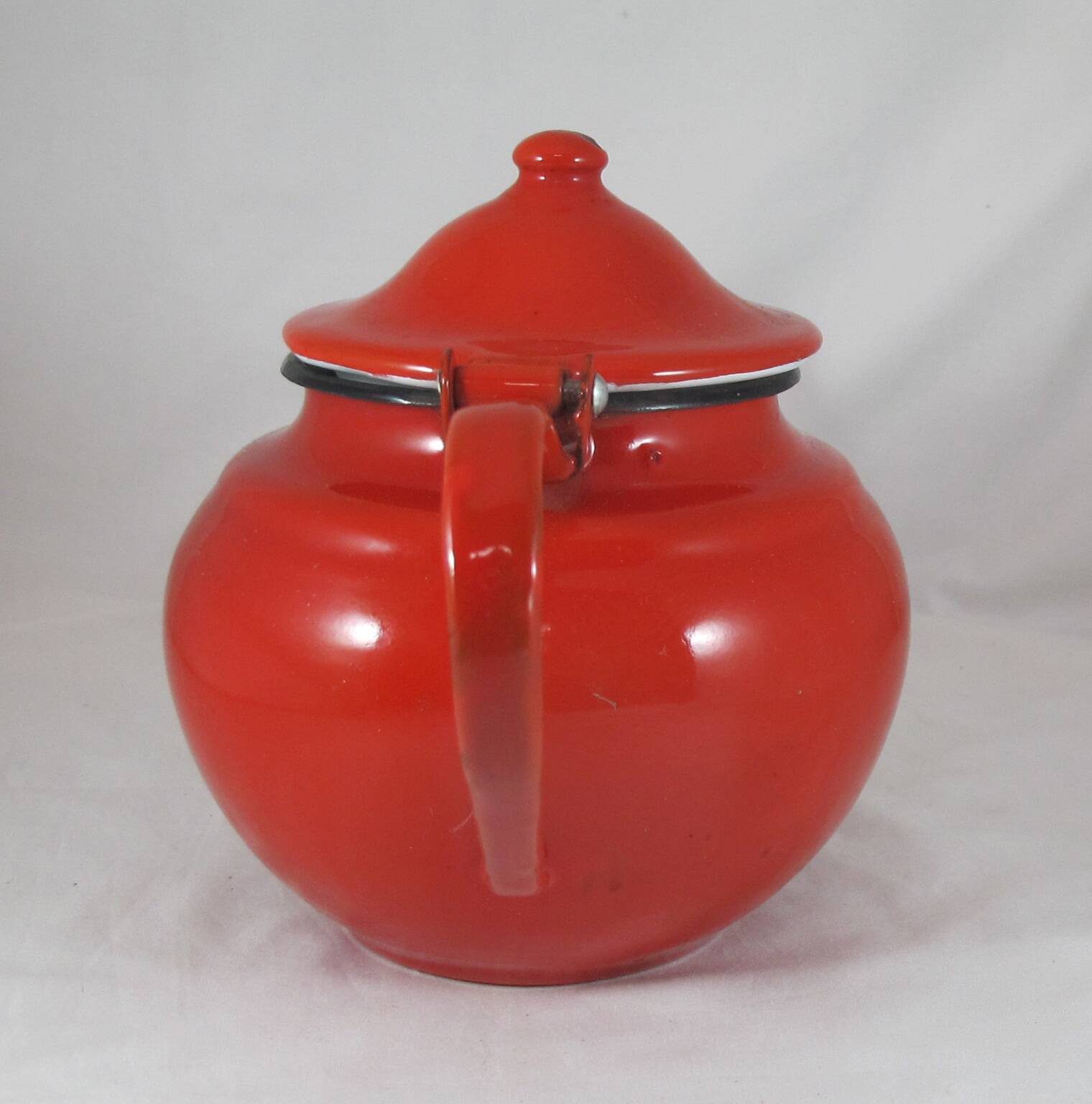Vintage teapot coffee maker in red enameled metal