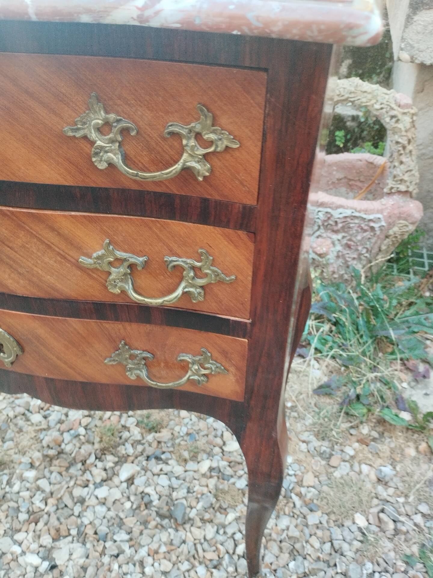 Antique marquetry commode with marble top in Louis XVI style.