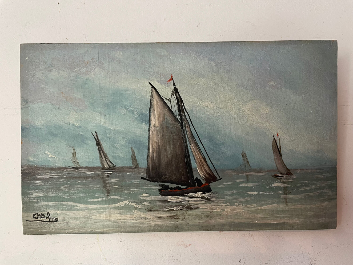 A pair of old paintings on wood.