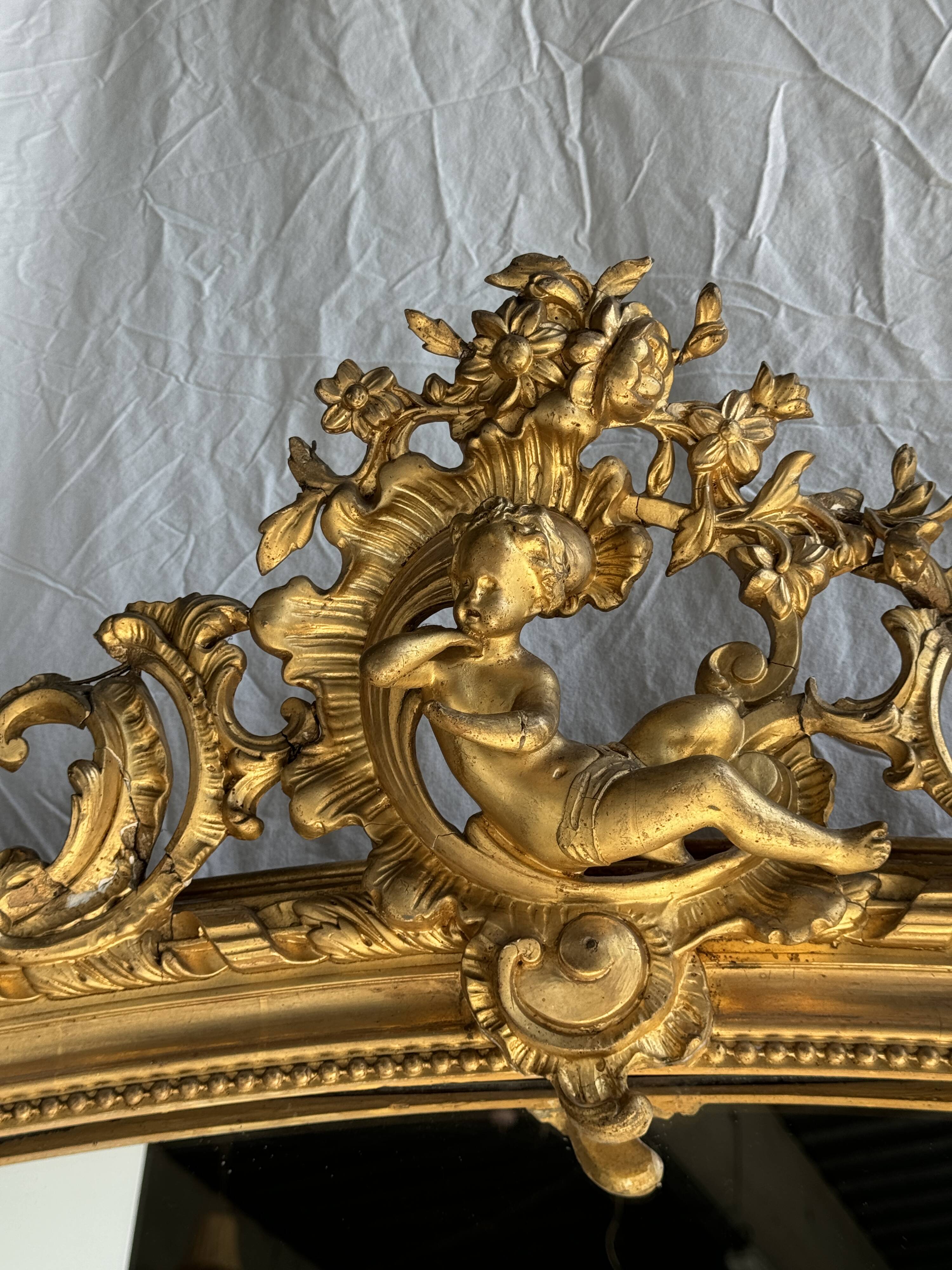 Large gilded mirror with acanthus leaf pediment H150 L98