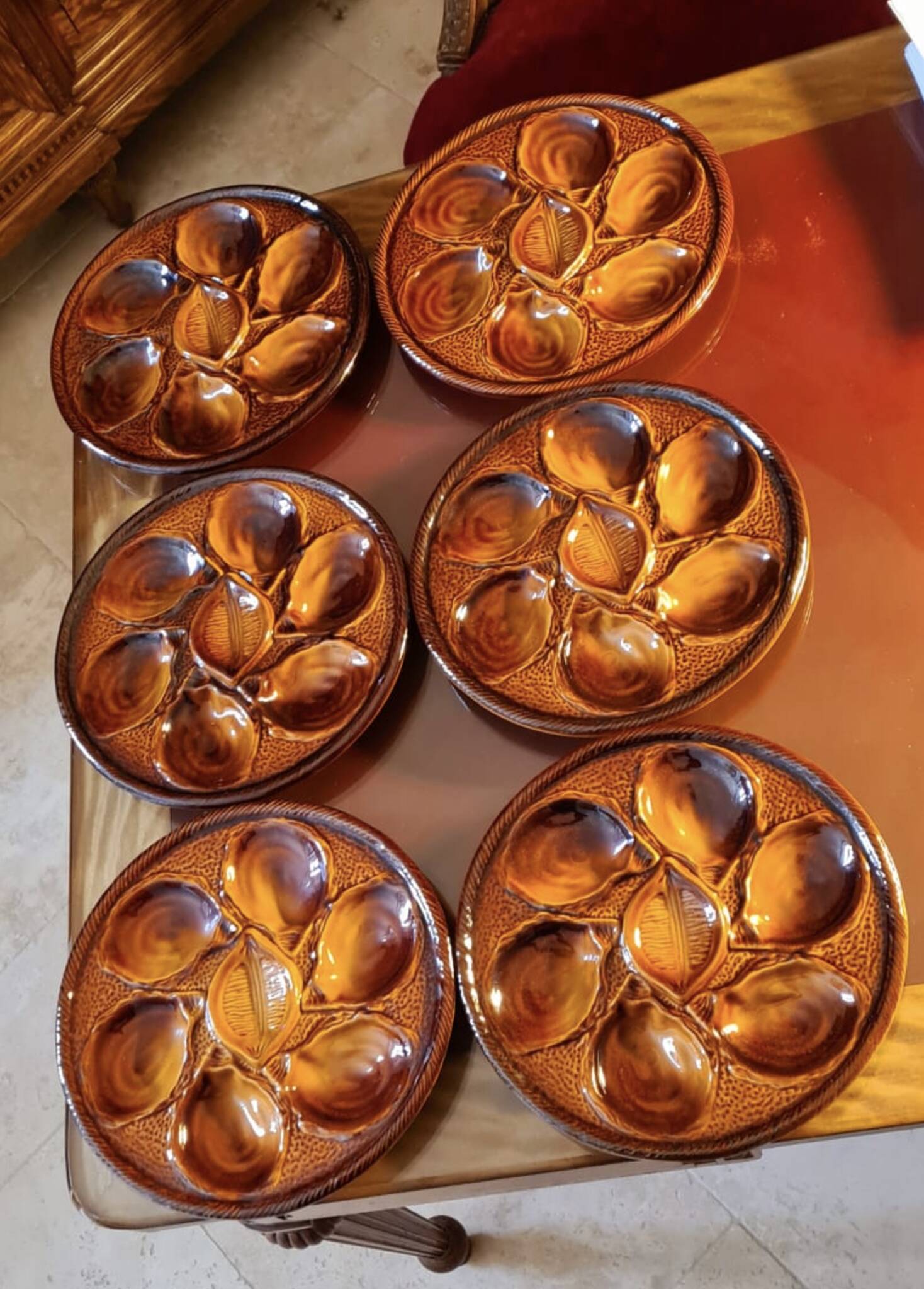 Six oyster plates signed Saint Clément