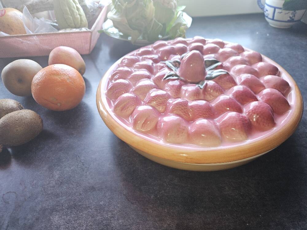 Glazed ceramic dessert plate with strawberry design.