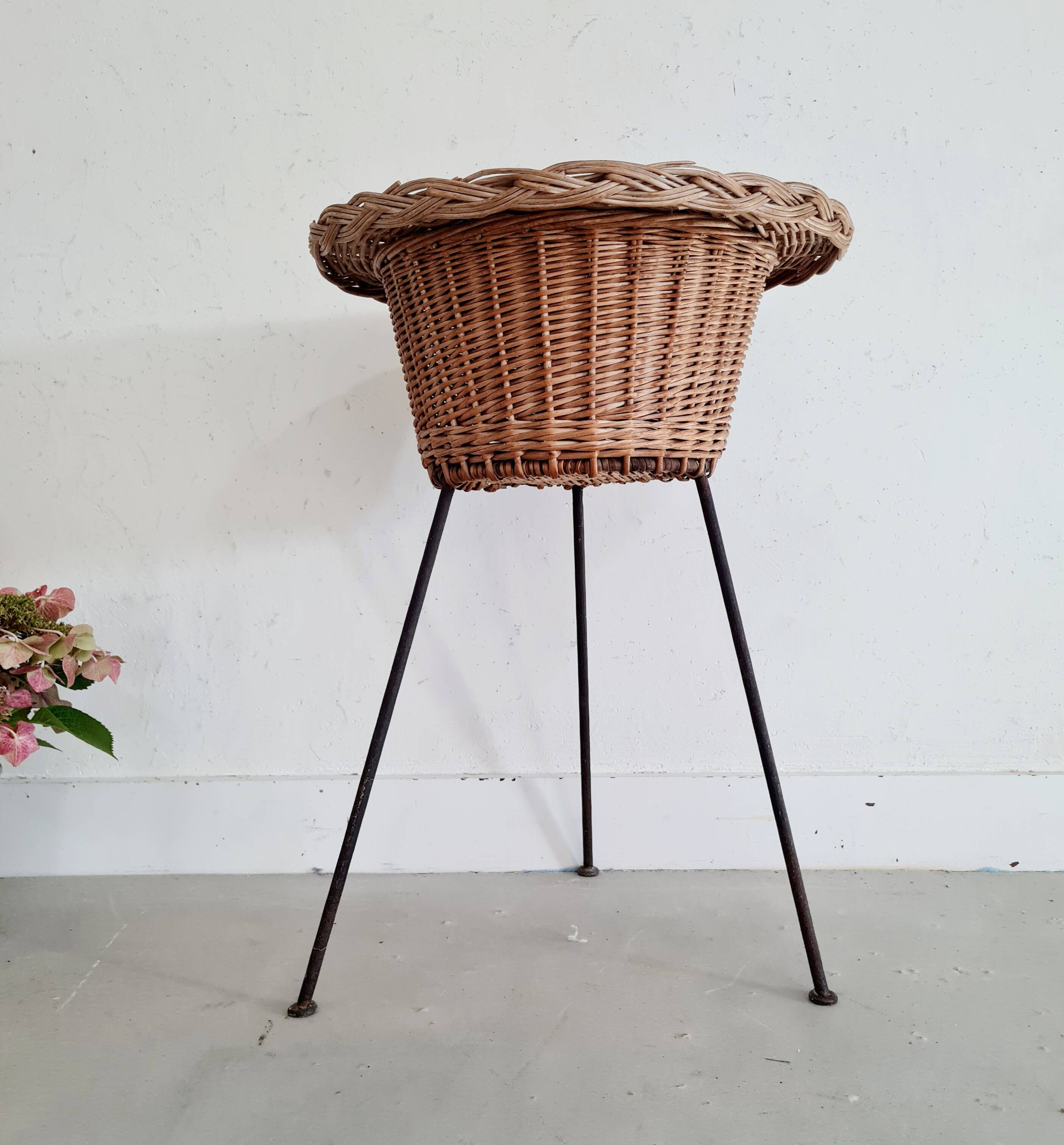 Rattan and metal tripod worker