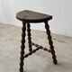 Two French farmhouse stools made of turned wood.