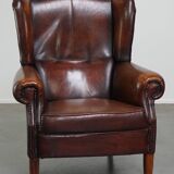 Luxurious sheepskin armchair with a fixed seat cushion and high seating comfort