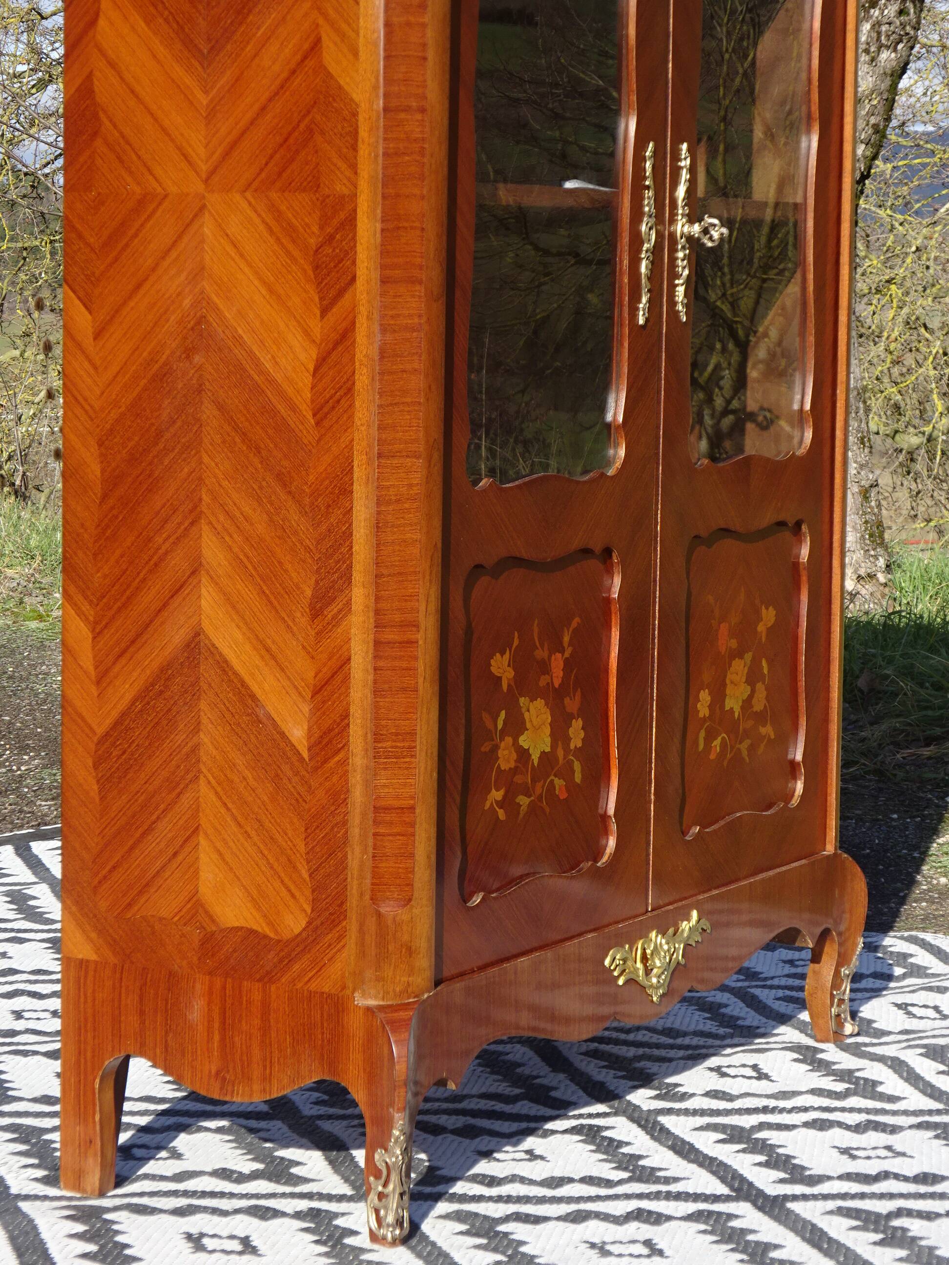 Glass library with rosewood marquetry in the Louis XV style.