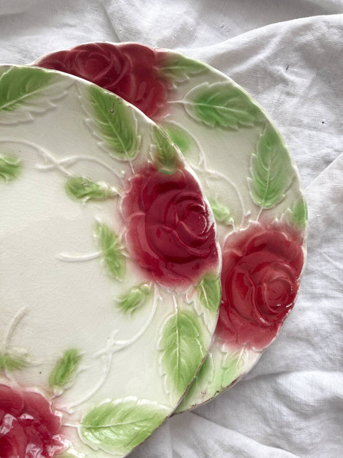 2 old slip plates decorated with roses