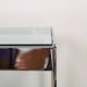 A vintage mid-century glass and rosewood side table by Merrow Associates