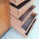Workshop furniture with drawers and curtain in beech and walnut.