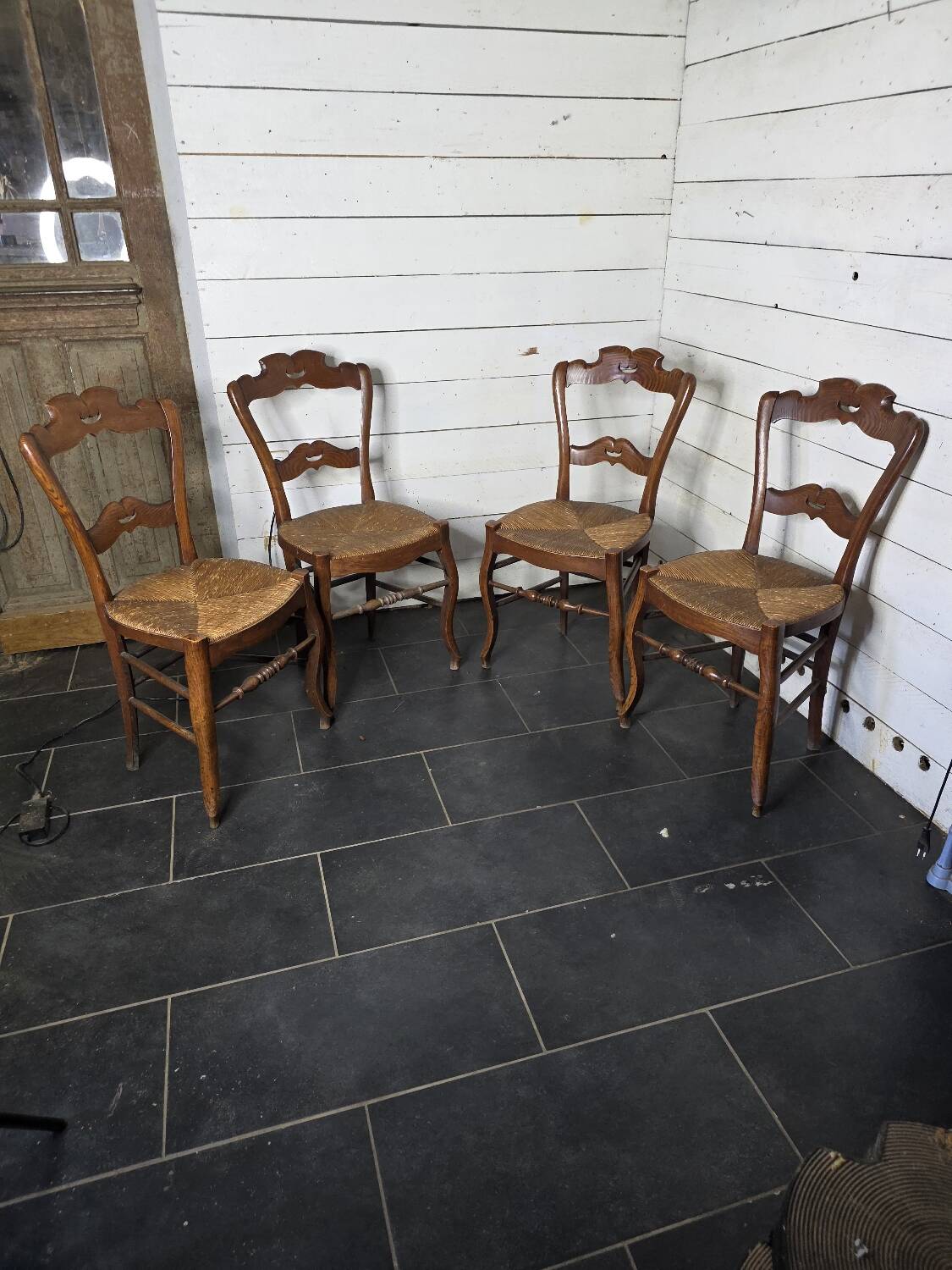 4 old straw chairs