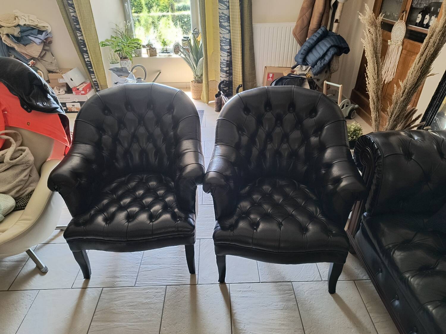Two Chesterfield armchairs