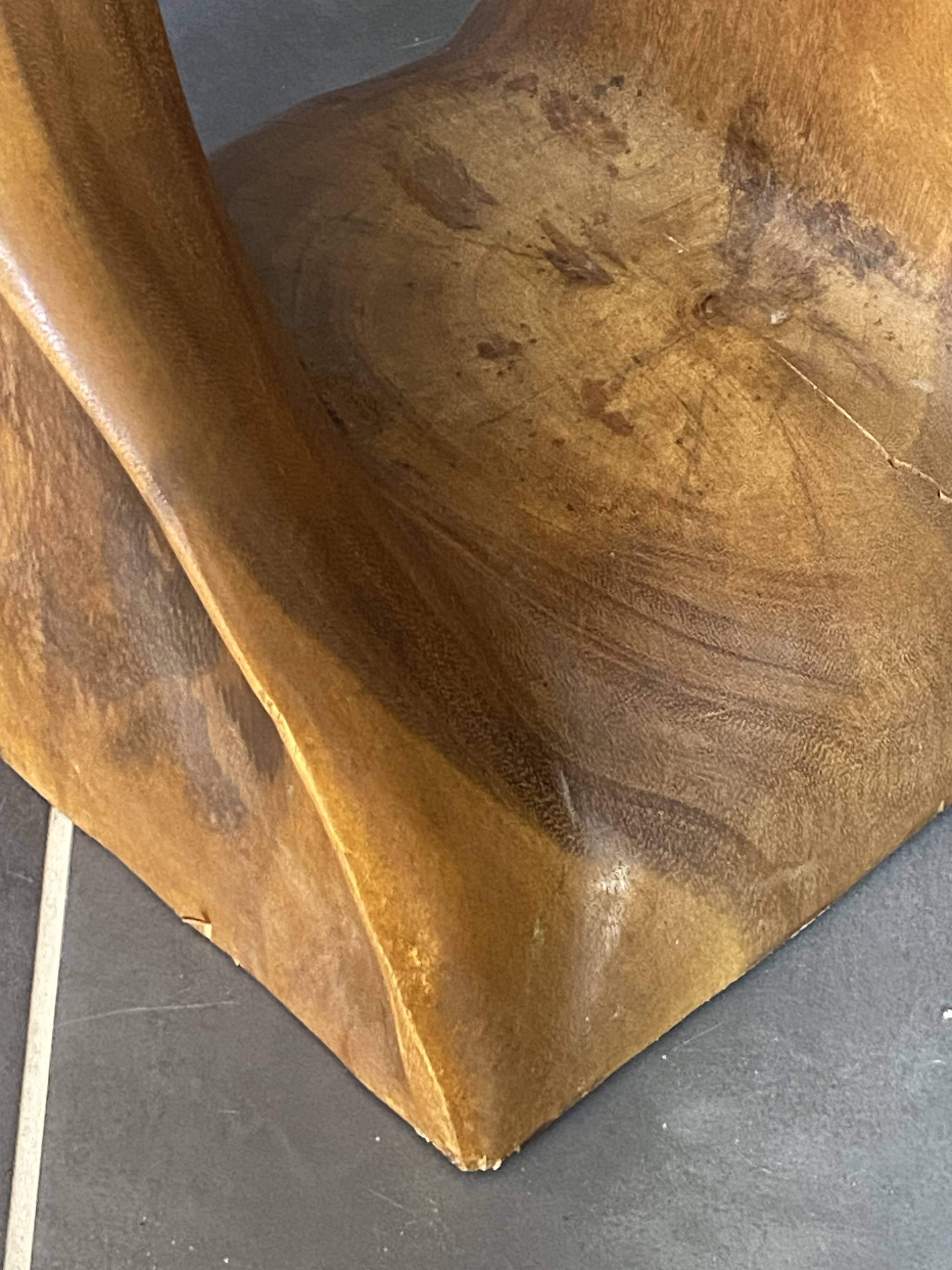 Stool no. 1 in solid raw walnut wood, carved from the mass, 1970.