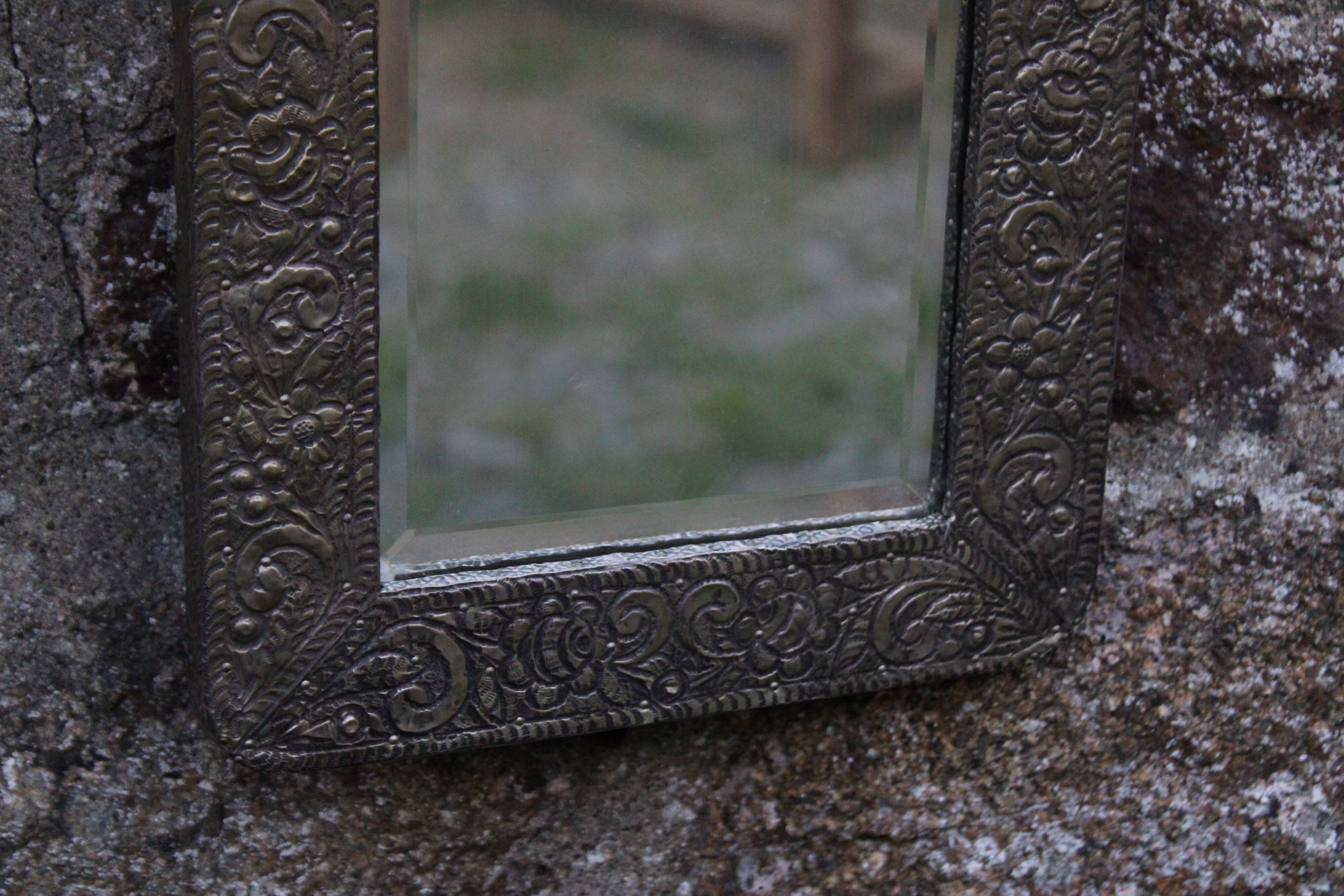 Oriental mirror in chiseled metal – beveled, for placing on a surface or hanging