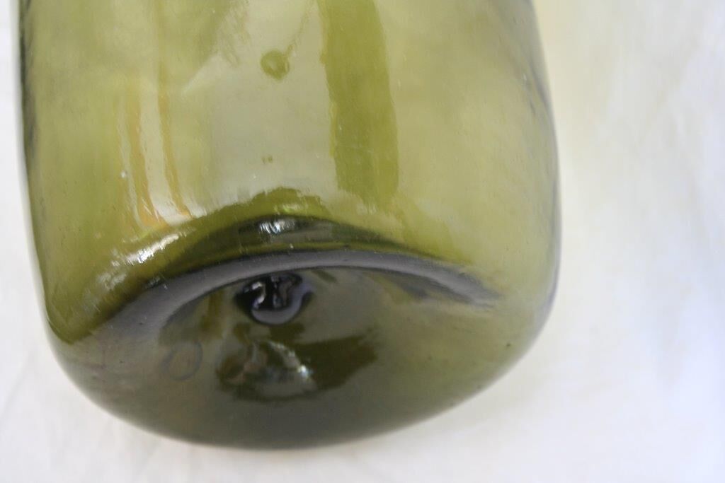 Blown green demijohn