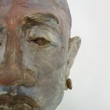 Face sculpture in polychrome earth and plaster, cabinet of curiosities. Ph Monaux. Ariège artist
