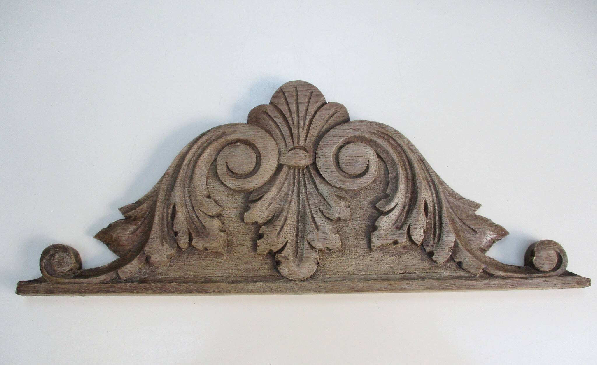 Old carved wooden pediment