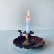 Old candle holder in brown enameled metal