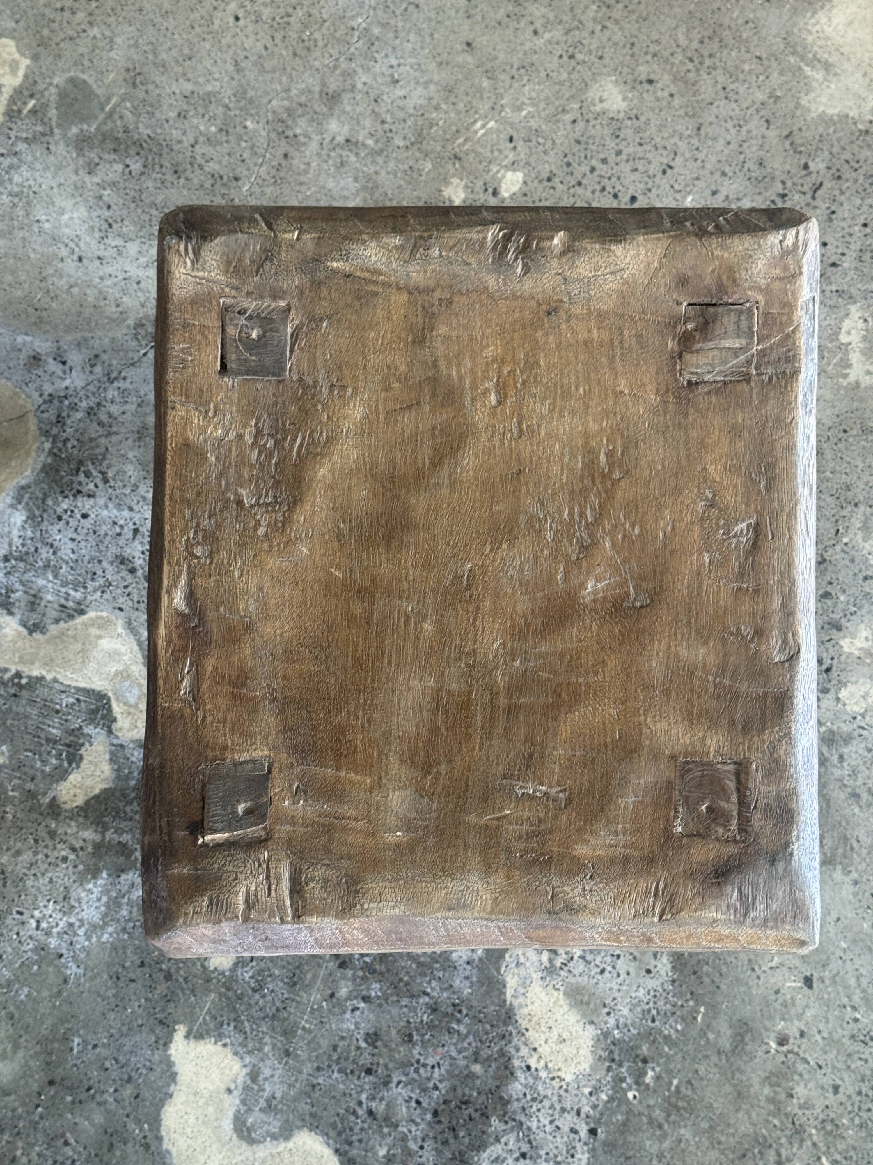 Small stool, square solid teak side table with a curved seat.