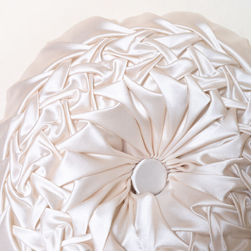 Old round cushion in white, beige pleated silk